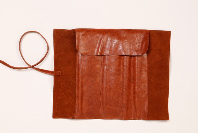 Trousse ronde marron en cuir véritable